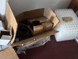 a cardboard box with a cat inside of it on the floor
