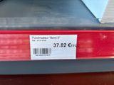 a label on the back of a red car