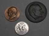 three coins are shown next to each other on a black surface
