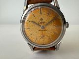 an image of a close up of a watch on a white surface