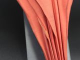 a close up picture of a folded umbrella on a table