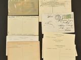 several old envelopes and postcards are sitting on a table