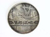 a picture of a silver coin with a picture of a ship on it