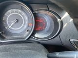 a close up of a car dashboard with a speedometer