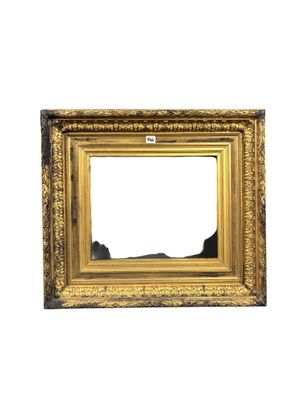 an old picture frame with a white background and gold trim