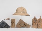 an image of a group of items including a hat, boots, and other items