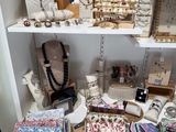 a shelf of jewelry on a shelf in a room