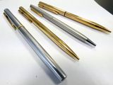 three different types of pens are lined up on a table
