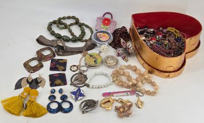 a lot of jewelry sitting on a white surface