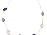 a close up of a necklace on a white background