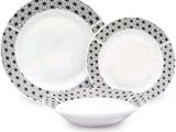 two plates with black and white designs on them on a white plate