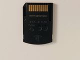a micro sd card attached to the back of a cell phone