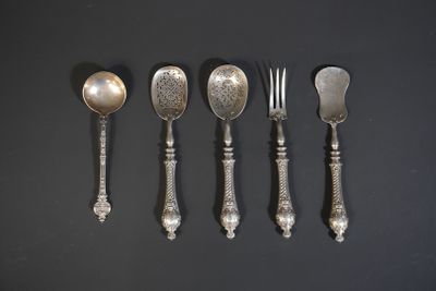 six spoons, forks and spoons are lined up on a black surface