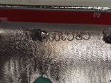 a close up of a car ' s emblem on the side of the car