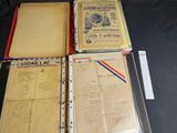 several folders of papers are sitting on a black table