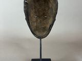 an image of a helmet on a stand on a white background