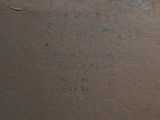 a brown box with writing on it sitting on a table