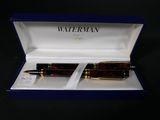 a pen in a box with a pen in it