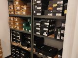 a room with a lot of boxes and boxes on the shelves