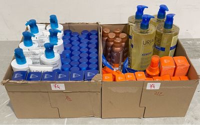 a cardboard box filled with bottles of different types of hair products