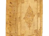 un vieux livre avec une couverture dorée sur fond blanc