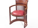 an image of a wooden chair with a red leather seat