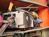 a pile of wires and tools in the back of a truck