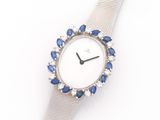 an image of a close up of a watch on a white surface
