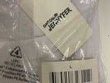 a white shirt that has a tag on it