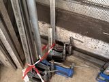 a bunch of tools sitting on the floor next to a wall