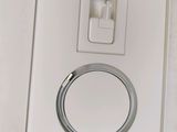 a white box with a silver ring inside of it