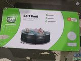 the box is open on the floor next to the swimming pool