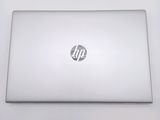 a white laptop with a hp logo on the screen