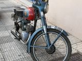 a motorcycle that is parked on the side of the street