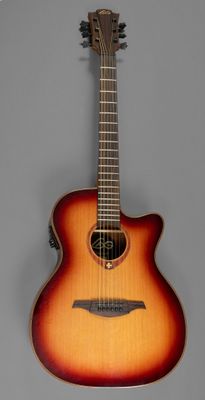 an acoustic guitar hanging on a wall in a room