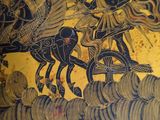 a plate with a picture of a man riding a horse