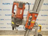 an image of a drill on a stand in front of a wall
