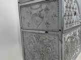 a silver metal box with a mirror on top of it