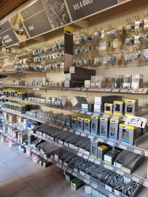 many electronic devices on the shelves in the store