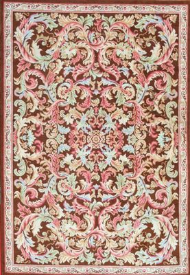 a brown and pink rug with a floral design on it