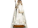 an image of a statue of the virgin of guadalupe on a pedestal