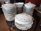 a lot of plates and bowls on a table