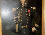 portrait of a man in a military uniform standing next to a painting of a man in a military uniform