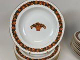 many plates stacked on top of each other on a table