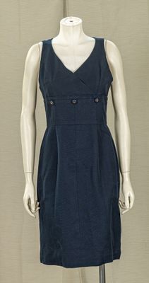 a mannequin dressed in a blue dress on display