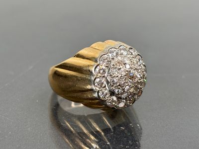 a close up of a diamond ring on a table
