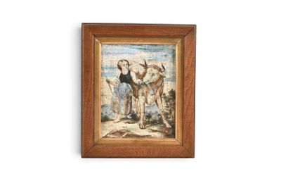 tableau encadré représentant un homme et deux vaches sur une plage