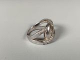 sterling silver ring with diamonds on a white background