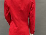 a mannequin wearing a red jacket and black pants