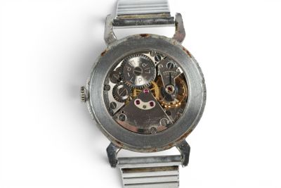 a watch that is sitting on a white surface
